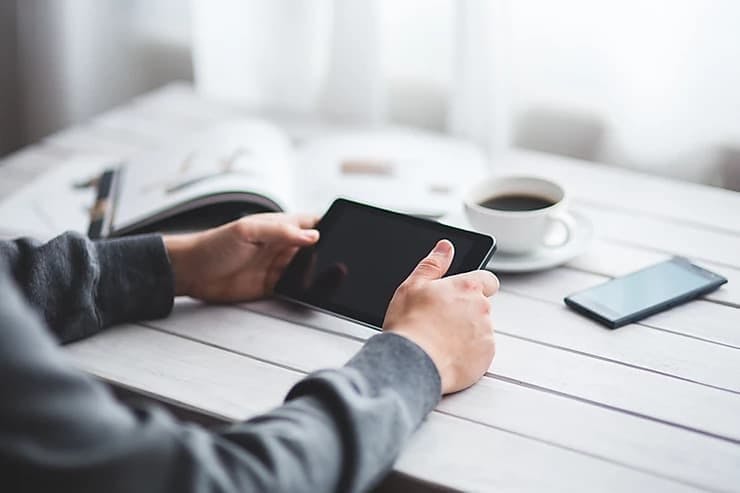 man holding a tablet